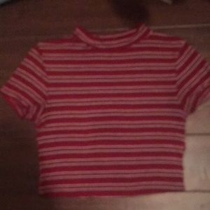 A red and white striped turtleneck tight shirt